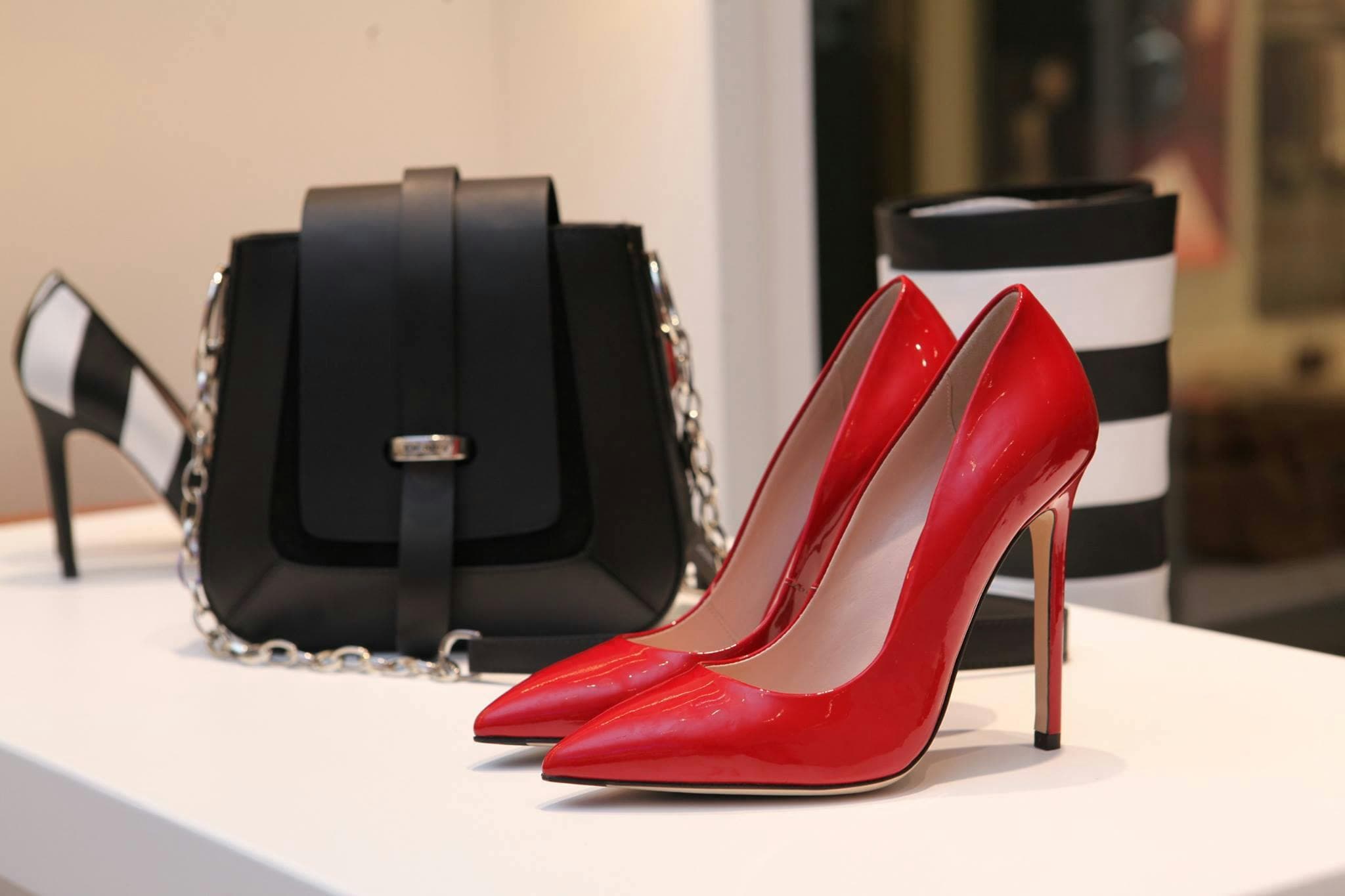 Red heels and black bag